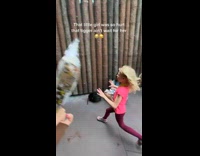 Little girl runs after tigger 