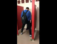 Blue sweater guy pees on covered urinal 