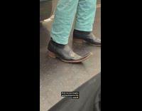 Man wears pointy boots on train 