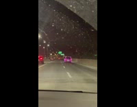 Red van in christmas lights drives 