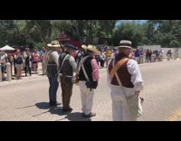 Hat men demonstrate musket reload and fire