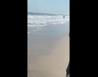 Friend runs after girl beach sand video 