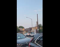 Man rides unicycle on street 