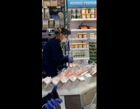 Lady wears plastic face shield grocery store 