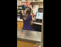 Girl purple scrubs dog computer work 