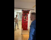 Man Slips as he Kicks Punch Machine