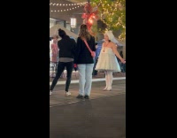 Woman tube dress video shoot at park