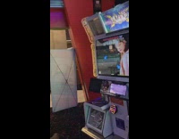 Lady falls off dance arcade game 