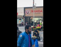 The Grinch drives around plays loud music