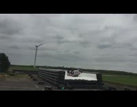 Car drives up ramp lands inflatable airbag 