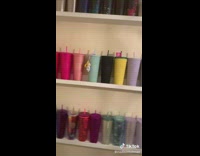 Pulling out new orange starbucks tumblr cup