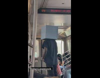 Man stand in train box cover head