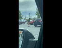 Guy dribble basketball parking lot bounce high