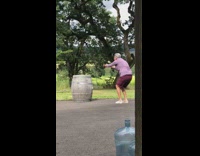 Grandpa bends over photographs wine glass barrel 