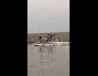 Two girls pole dance on boat lake