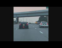 White car filmed in highway golden hour