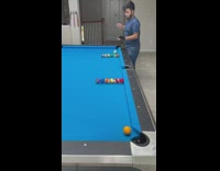 Guy does curved tricks playing pool 