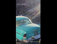 Car parked on street with cocky plate