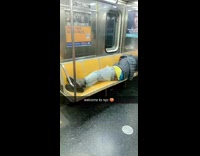 Homeless man sleeps on subway seats with his butt sticking out
