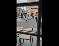 Girl long coat pose middle of the street