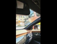 Slow motion hotdog shaped car pass by