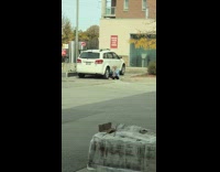Woman jean jacket sit car tires selfie