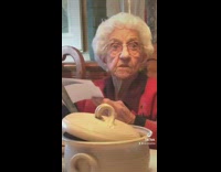 Family watches boy do backflip on trampoline from dinner table