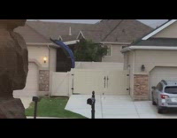 Neighbor trampoline flew into backyard roof wind 