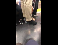 Man doing pull ups on subway train