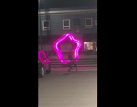 Giant pink neon star couple photoshoot 