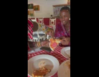 Guys at pizza restaurant try pizza for first time