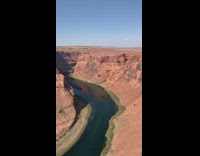Girl makes bed outside canyon edge