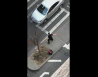 Guy black shirt black pants dancing middle of street island center block