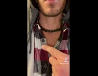 Baby monkey wraps tail around guys neck