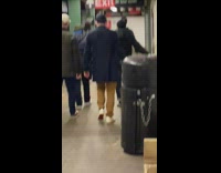 Walking out of subway station with a fake deer head