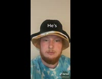 Blue shirt guy wears multiple bucket hats 