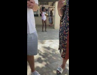 Woman bikini carries three drinks dance selfie