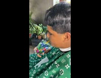 Guy offers barber sip of his capri sun 