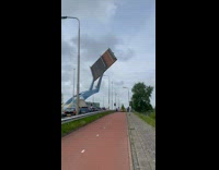 Mechanic arm let down the part of the road that is a bridge