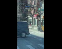 Red pants guy dances while walking sidewalk 