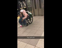 Woman in pink jacket wheelchair smokes weed in subway station