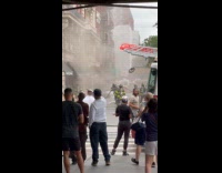 Firemen put out fire from a store