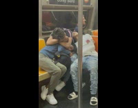 3 people sleep and cuddle on train 