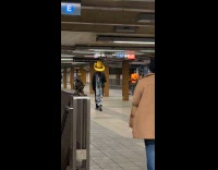 Man giant cowboy hat in subway station