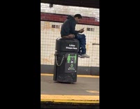 Man poop sit over trash can subway