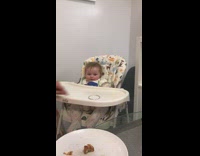 Baby laugh at bangle spin on highchair