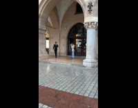 Man in black photoshoot inside building arc