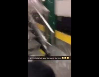 Guy slides down subway station stairs and rips open back of jacket 