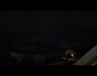 Lightning seen on dark clouds in sky