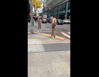 Brown sweater sweatpants girl poses crosswalk guy 